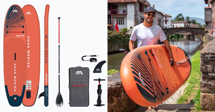 Paddleboard Aqua Marina Monster 12'0" i mężczyzna przenoszący go za uchwyty transportowe