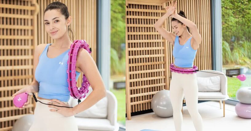 Kobieta ćwiczy w domu z hula hop z obciążeniem