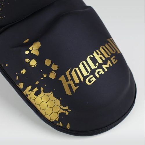 Ochraniacze piszczeli i stóp  Ground Game Cage Gold czarne/złote