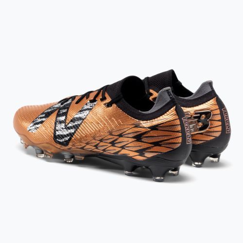 Buty piłkarskie męskie New Balance Tekela Pro Low Laced V4+ FG copper