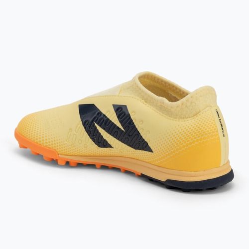 Buty piłkarskie dziecięce New Balance Tekela Magique V4+ Jr TF beige