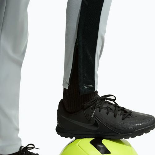 Spodnie dziecięce Nike Academy Dri-Fit Jr light smoke grey/white/black/metallic gold