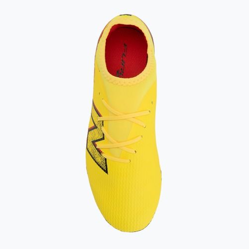 Buty piłkarskie dziecięce New Balance Furon Team V8 FG punch yellow/black 100/fire cracker