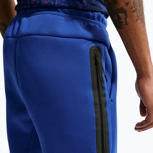 Spodnie piłkarskie męskie Nike FFF Tech Fleece Joggers game royal/metallic copper