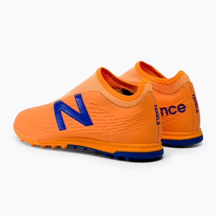 Buty piłkarskie dziecięce New Balance Tekela V3+ Magique JNR TF impulse/vibrant orange 3