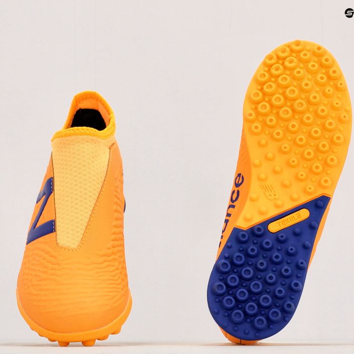 Buty piłkarskie dziecięce New Balance Tekela V3+ Magique JNR TF impulse/vibrant orange 10