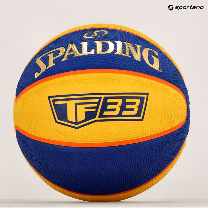 Piłka do koszykówki Spalding TF-33 Official żółta/niebieska rozmiar 6 5