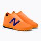 Buty piłkarskie dziecięce New Balance Tekela V3+ Magique JNR TF impulse/vibrant orange 4