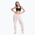 Spodnie damskie New Balance Athletics Nature State French Terry washed pink 2