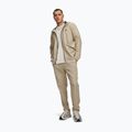 Spodnie treningowe męskie Under Armour Unstoppable Tapered Pants city khaki/black 2