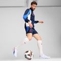 Buty piłkarskie PUMA King Ultimate FG/AG puma white/bluemazing/flat light grey/sunset glow 10
