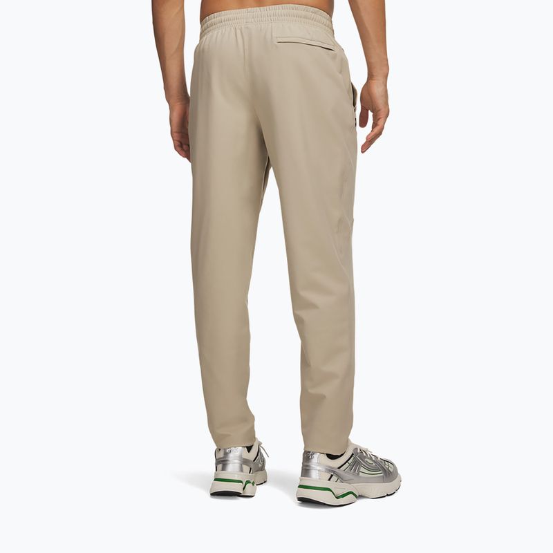 Spodnie treningowe męskie Under Armour Unstoppable Tapered Pants city khaki/black 3