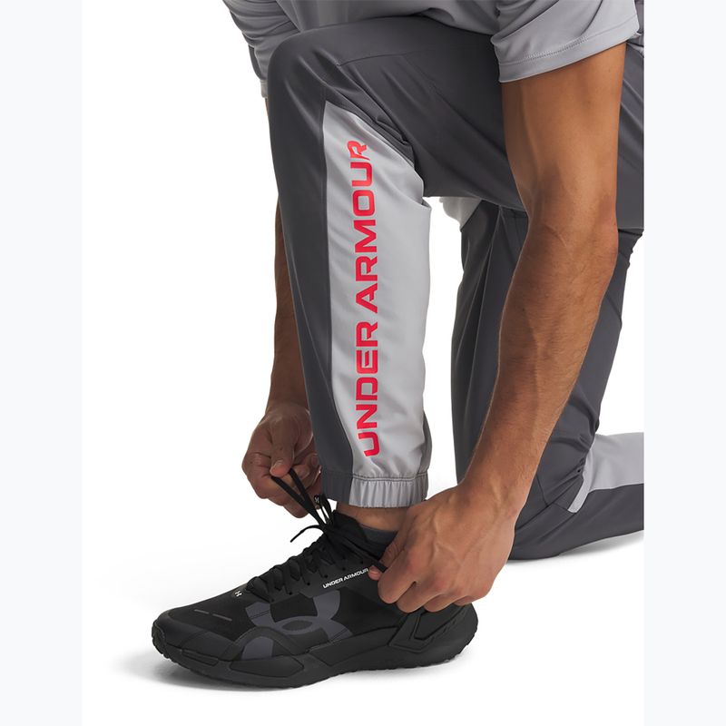 Spodnie treningowe męskie Under Armour Tech Utility Woven Pants castlerock/mod gray/racer red 5