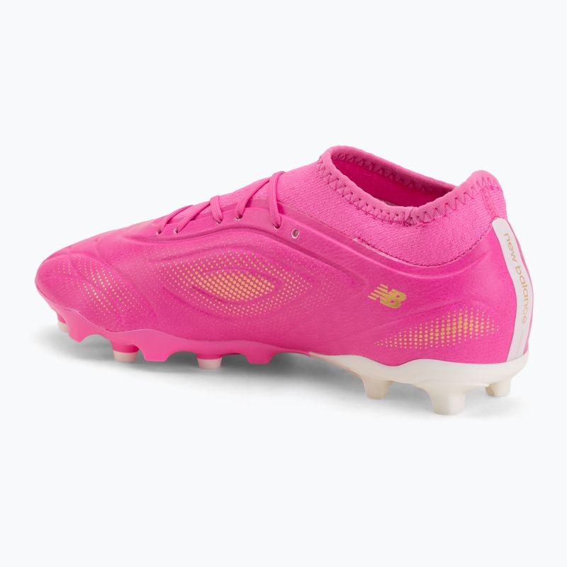 Buty piłkarskie dziecięce New Balance Tekela Team V5 pink heat/metallic gold/pink satin 3