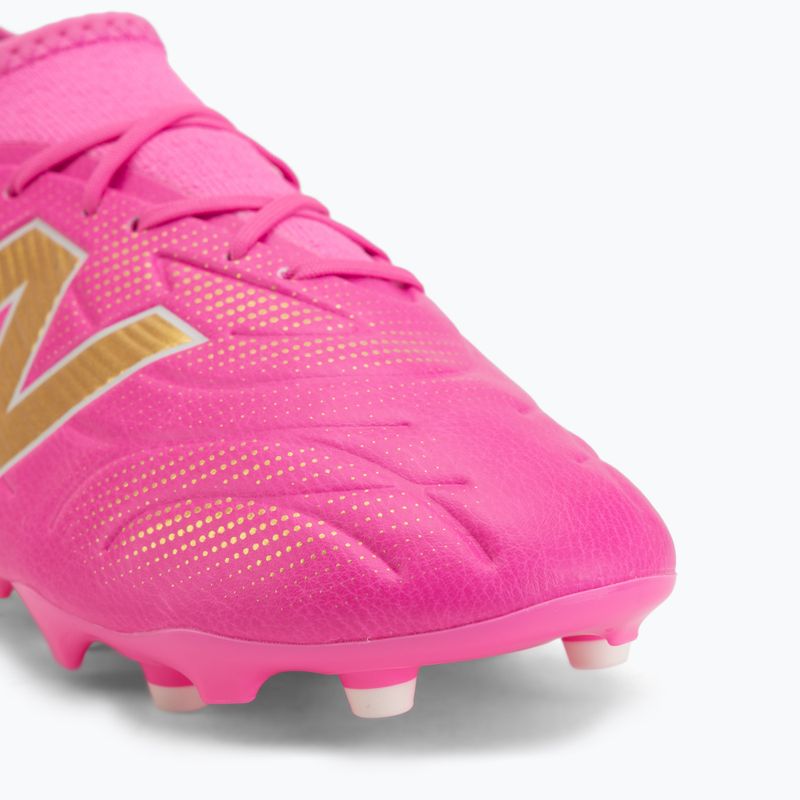 Buty piłkarskie dziecięce New Balance Tekela Team V5 pink heat/metallic gold/pink satin 7