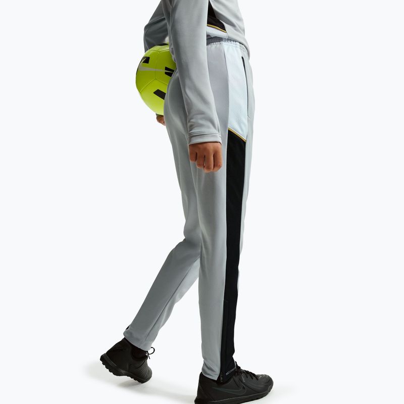 Spodnie dziecięce Nike Academy Dri-Fit Jr light smoke grey/white/black/metallic gold 6
